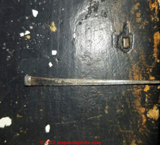Square headed tapered nail in 1869 farm house stairs (C) InspectApedia.com Kami H