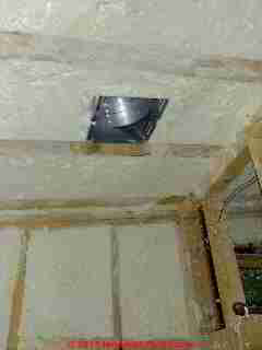 Insulation at bath vent fan © D Friedman at InspectApedia.com 