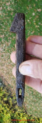 Antique iron spike with oblong hole in tip and offset head (C) InspectAPedia.com Perry