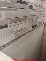 Support for backsplash across areas where countertop is absent (C) Inspectapedia.com A Church