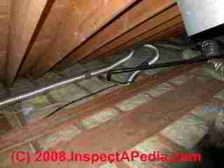 Uninsulated fan ducts in an attic (C) Daniel Friedman