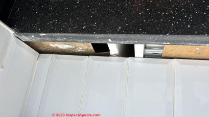 Mold on un-coated surfaces of cabinet backs - remove cabinets to clean and then seal (C) Inspectapedia.com Wolfe