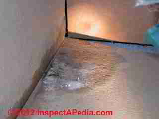 Cabinet water damage from dishwasher © D Friedman at InspectApedia.com 