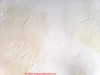 moisture or water stain on ceiling (C) InspectApedia.com John