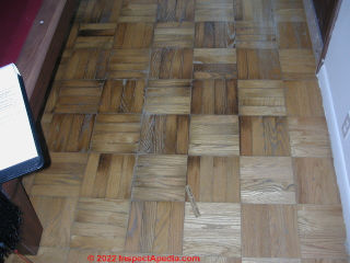 Pet stained parquet flooring (C) Daniel Friedman InspectApedia