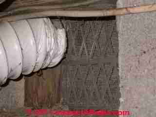 Dryer vent duct at crawl space vent © D Friedman at InspectApedia.com 