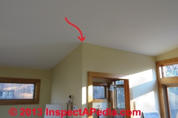 Ceiling drywall crack at natural stress point following framing shrinkage in new construction © Daniel Friedman