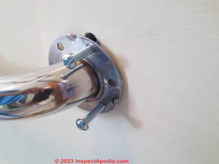 Adjust the exact position of the grab bar where toggle bolts require large holes (C) Daniel Friedman at In spectApedia.com