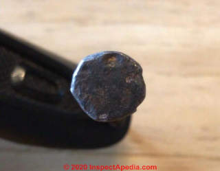 Round head of a nail (C) inspectApedia.com Dan