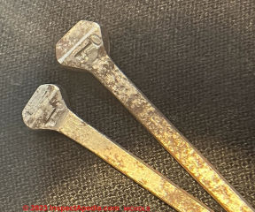 Horseshoe nail with a key embossed in the nail head - brand TBD - (C) InspectApedia.com Nicholls