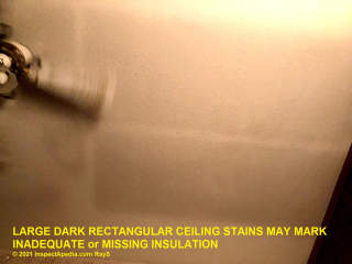 Large dark rectangles on a ceiling - ghosting stains - poor or missing insulation (C) InspectApedia.com Ray S