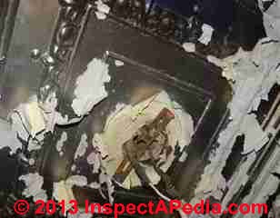 Water damaged tin ceiling (C) InspectAPedia JN