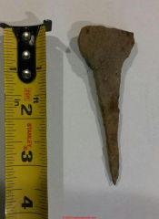 Possible antique horse shoe nail from New England (C) InspectApedia.com Julie