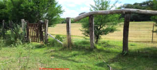Wooden pegs in horse pasture posts San Miguel de Allende Mexico (C) InspectApedia.com DJF
