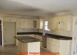 Dark stains on kitchen ceiling may be from insulation defects, drafts, heat loss - plus a soot source in the kitchen (C) InspectApedia.com - reader photos