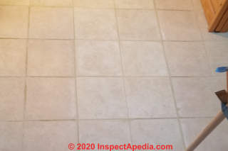 Finished repair of replacing broken ceramic floor tiles (C) Daniel Friedman at InspectApedia.com