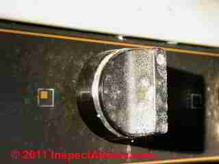 Photo of mold on a kitchen stove plastic control(C) Daniel Friedman