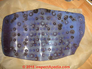 Moldy vinyl shower mat (C) InspectApedia.com Monica M