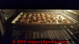 Morchella esculenta  morel mushrooms drying in the oven (C) Daniel Friedman at Inspectapedia.com