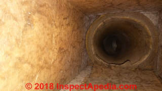 Fiberglass HVAC ducts can collect particles inviting mold but this duct is rather clean (C) InspectApedia.com LT
