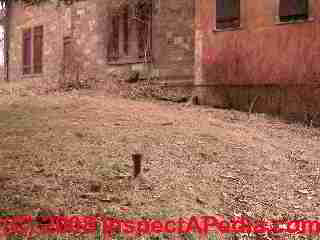 Fill pipe telltale evidence of a burie oil tank, a UST (C) InspectApedia.com