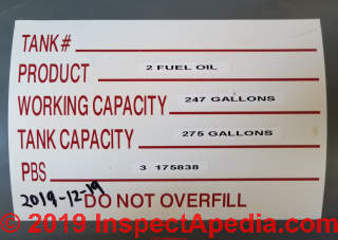 Oil tank label showing working capacity vs total tank capacitdy for No. 2 fuel oil - residential 275g tank (C) Daniel Friedman at InspectApedia.com