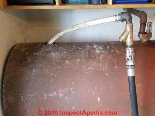 Pumping heating oil into temporary storage to prepare for oil tank replacement (C) Daniel Friedman at InspectApedia.com 