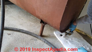 Close oil tank drain valve and remove oil lline to burner (C) Daniel Friedman at InspectApedia.com
