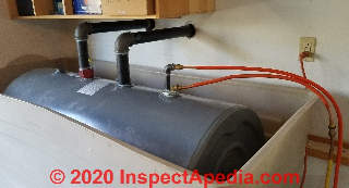 Oil tank with new oil supply and return piping for a 2-line oil burner installation (C) Daniel Friedman at InspectApedia.com