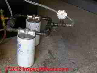 Oil filters and vacuum gauge at boiler © D Friedman at InspectApedia.com 