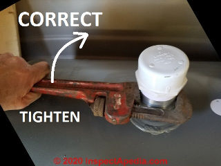 Correct position to use a pipe wrench to tighten a fitting or pipe into an opening (C) Daniel Friedman at InspectApedia.com