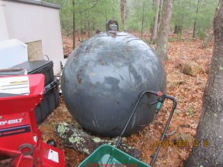 Spherical oil storage tank, removed, cleaned, and retained by the excavation contractor (C) Inspectapedia.com Grudzinski