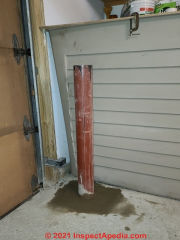 Finished bollard installation into garage floor slab (C) Daniel Friedman at InspectApedia.com