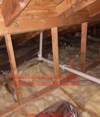 Improper vent pipe slope in attic (C) InspectApedia. com Susan