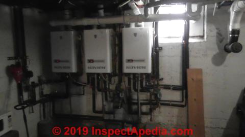 Navien CH water heaters installed in a US Basement (C) InspectApedia.com Joe