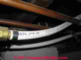 PEX Clamp fitting installation © D Friedman at InspectApedia.com 