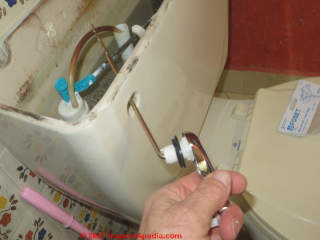 New toilet flush handle and lever (C) Daniel Friedman at InspectApedia.com