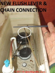 New flush lever connected to chain that lifts the flapper valve or flush valve of this toilet (C) Daniel Friedman at InspectApedia.com