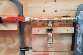 Sharkbite connectors in use at a tanklless water heater (C) Daniel Friedman at InspectApedia.com
