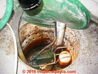 Sump pump in pit © D Friedman at InspectApedia.com 