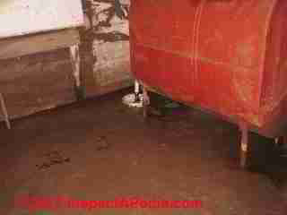 Sump in flooding basement © D Friedman at InspectApedia.com 