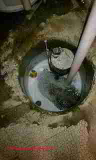 Sump pit with cover off - sudsy © D Friedman at InspectApedia.com 