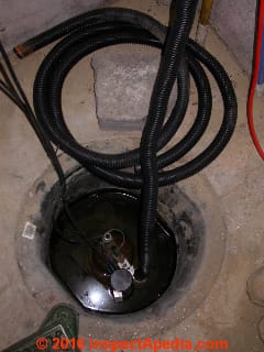 Sump pump with flexible plastic discharge tubing (C) Daniel Friedman