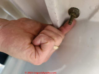Optional: remove the toilet tank from the toilet base to make removing a heavy toilet easier  (C) Daniel Friedman at InspectApedia.com