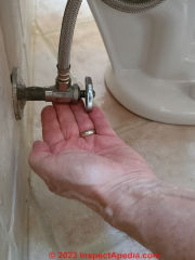 After installing the new toilet and turning on its water, check for leaks - (C) Daniel Friedman at InspectApedia.com