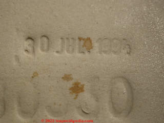 Standard toilet tank date stamp (C) Daniel Friedman at InspectApedia.com