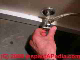 New toilet flush handle and lever (C) Daniel Friedman at InspectApedia.com