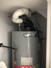 Poor routing of plastic vent for AO Smith water heater - may be unsafe (C) InspectApedia.com Manuel