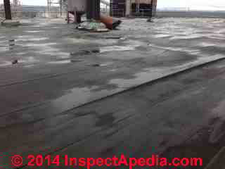 Single ply roof over corrugated asbestos cement roof decking (C) InspectApedia GS