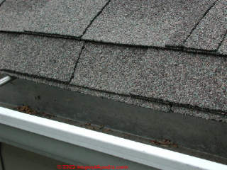 Excessive asphalt shingle overhange at roof eaves (C) Daniel Friedman at InspectApedia.com